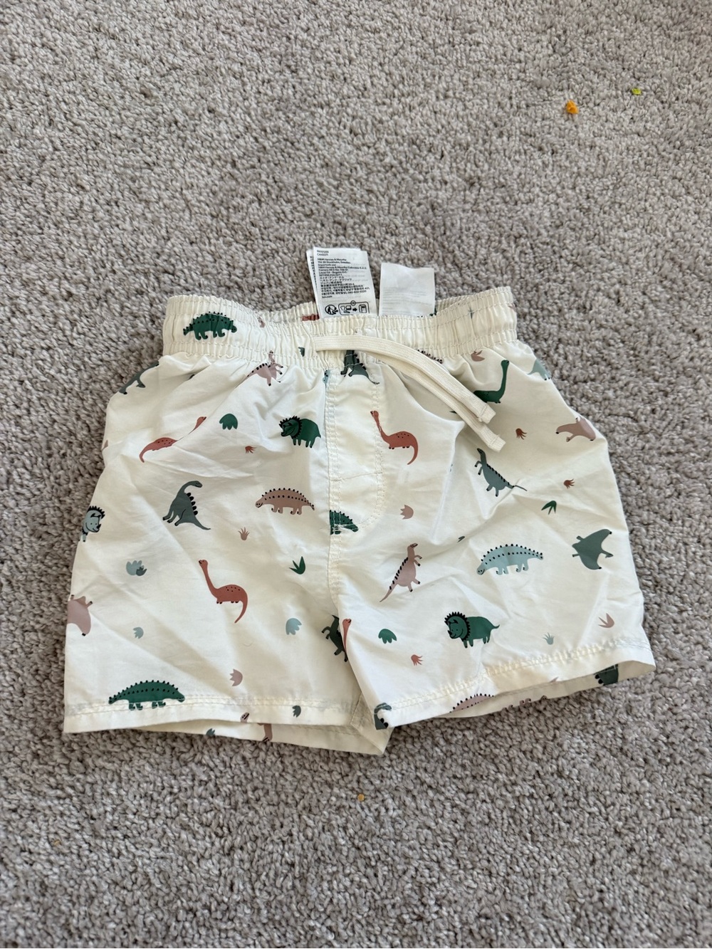 H&M Cream Dino swim trunks